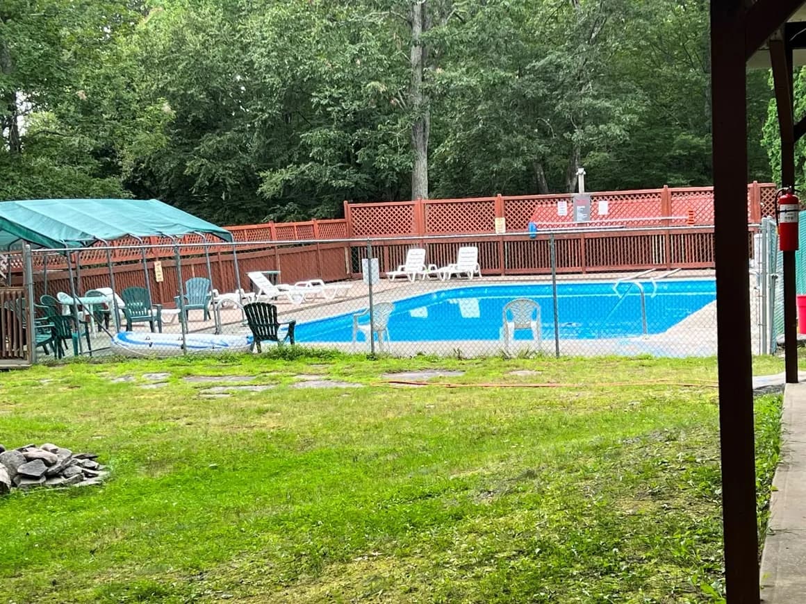 Community swimming pool with lounge chairs